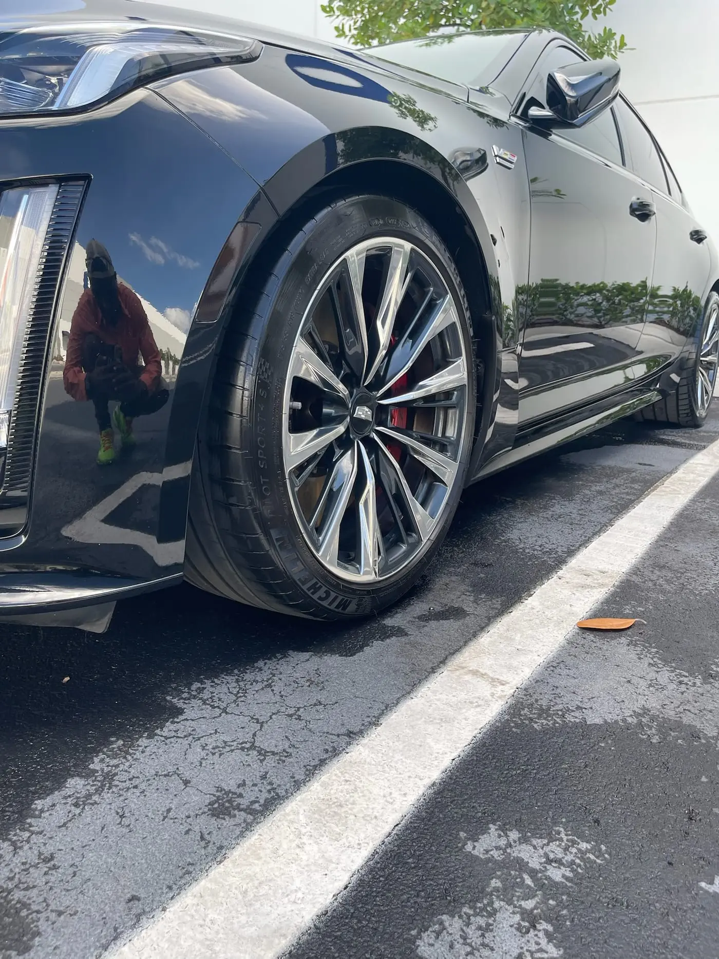 A black Cadillac CT5-V Blackwing with deep gloss paint and polished wheels