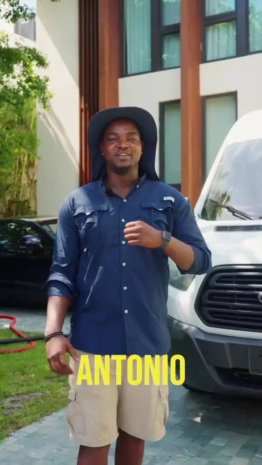 Antonio from Scrub N Sudz standing in front of the company van